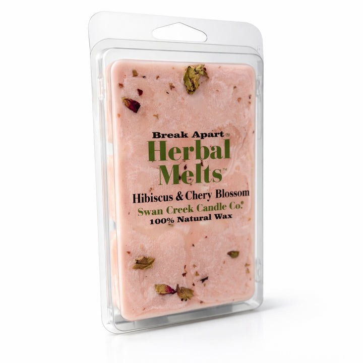 Packaged herbal wax melts with visible herbs on a white background