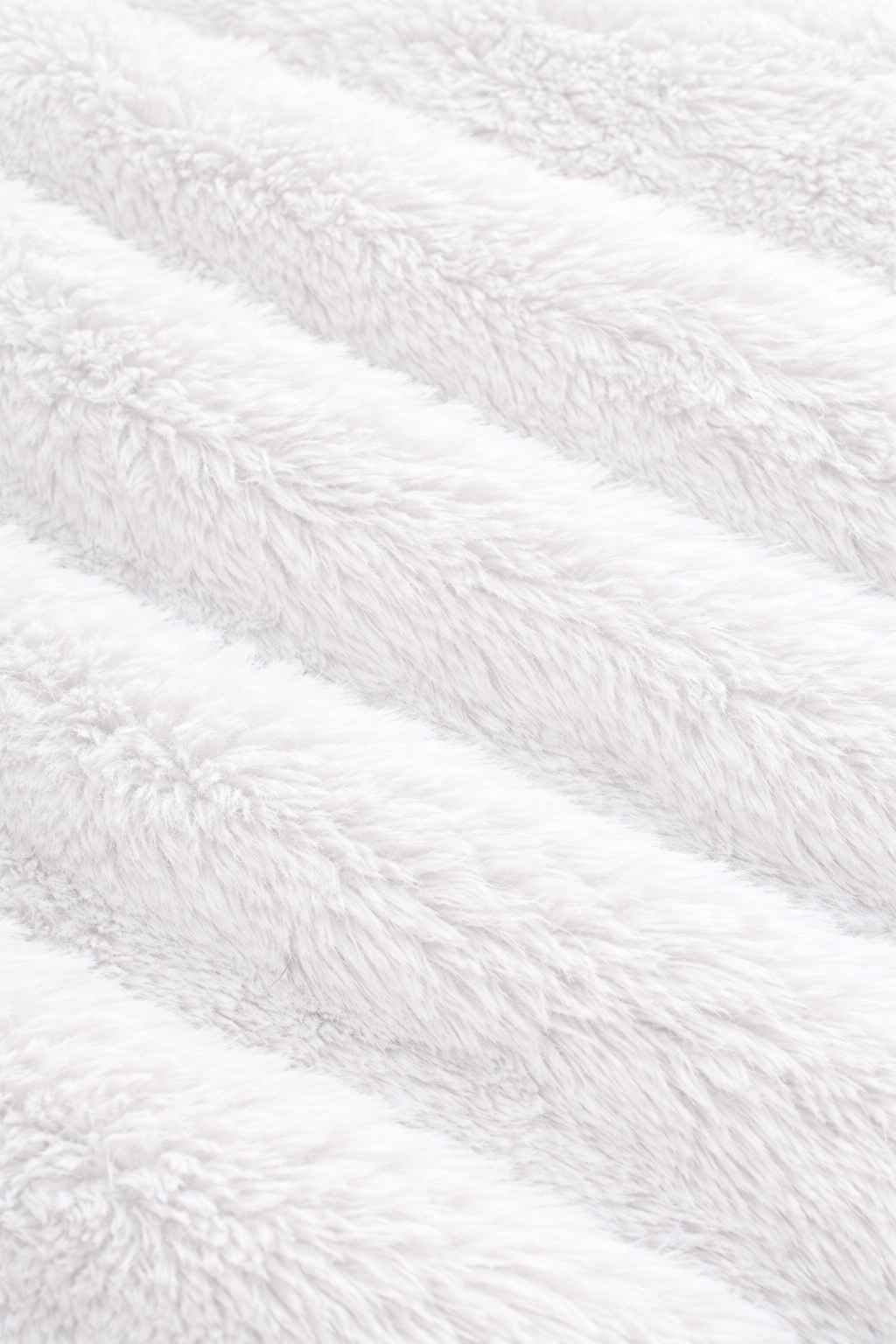Close-up of white fluffy blanket