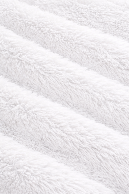 Close-up of white fluffy blanket