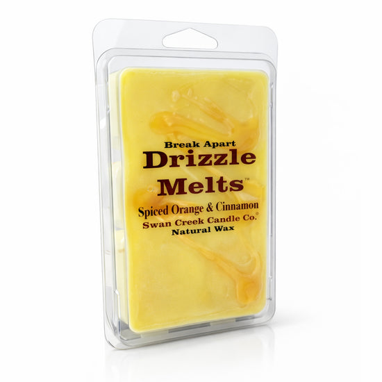 Packaged Drizzle Melts by Swan Creek Candle Co. with spiced orange & cinnamon fragrance on a white background.