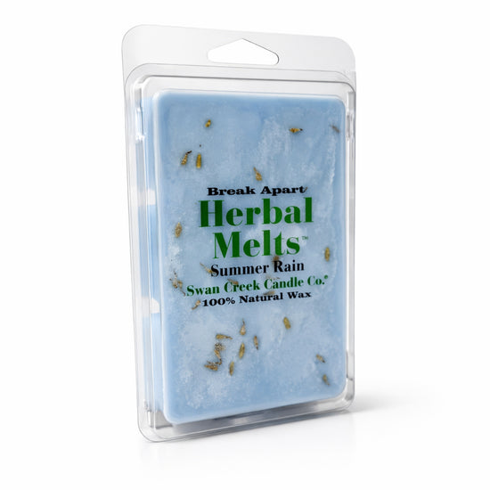 Packaged herbal melts with 'Summer Rain' scent by Swan Creek Candle Co on a white background